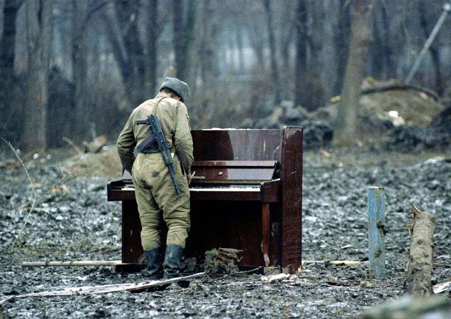 russian soldier playing piano in chechynia